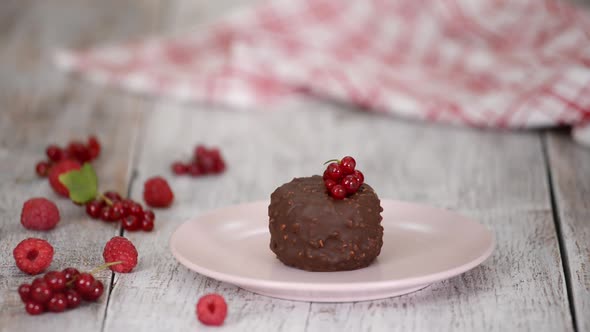 Decorating the Chocolate Ice Cream with Berries