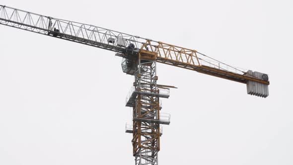 Tower Crane Working on Construction Site Cloudy Day Clear Sky on Background