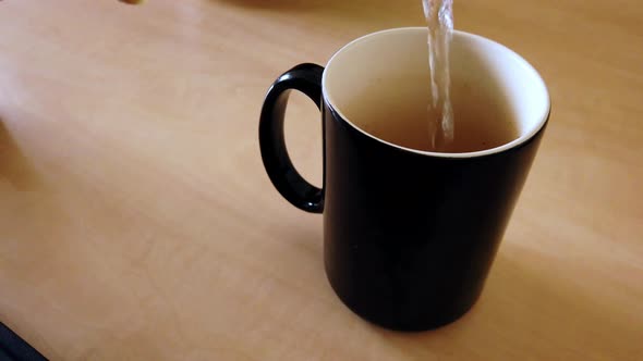 To make that tea, you need to pour that hot water (Slow-Motion)