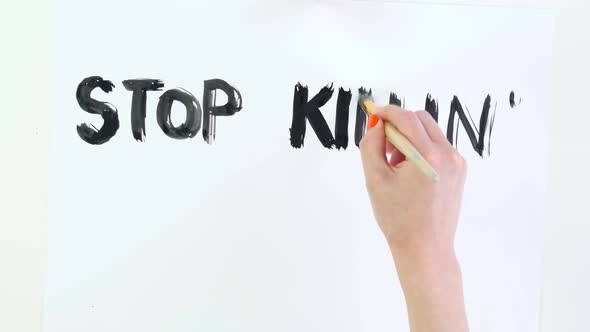 Timelapse. Close-up, Hand Writes Slogan - Stop Killing Black People - with Brush, Using Black Paint