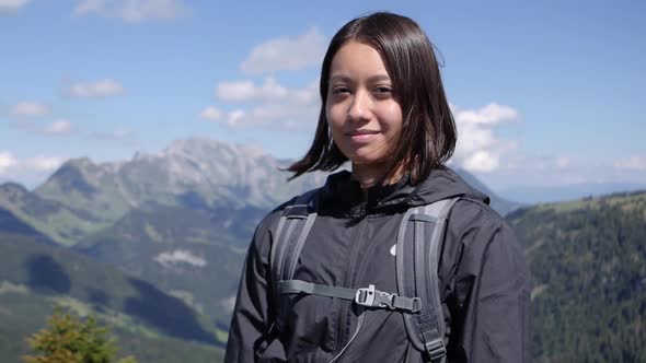 Portrait of a hiker girl posing in slow motion at Amden Swiss