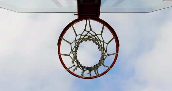 Basketball going through basketball hoop 4k