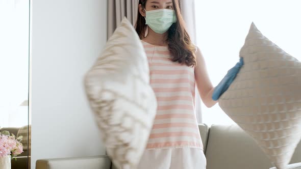 Woman housekeeper in mask cleaning at home. Close up of maid