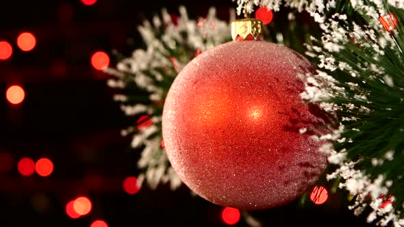 Unusual Decoration - a Round Red Toy on Christmas Tree, Bokeh, Light, Black, Garland