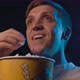 Man watching a funny comedy movie at the cinema, he is laughing and eating popcorn - VideoHive Item for Sale