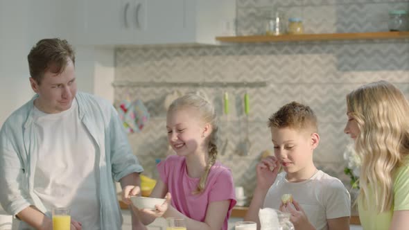 Happy Family Having Healthy Breakfast at Home