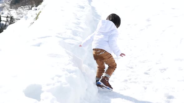 Cute Asian Child Playing Snow Outdoors Slow Motion