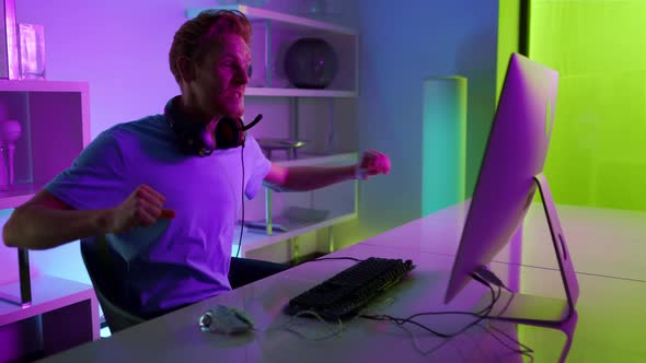 Cyber Game Winner Enjoying Success in Neon Room