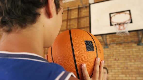 Determined high school kids playing basketball