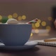 Slow Motion Orbit Shot Man Drinking Hot Chocolate From Blue Cup Evening Making Shopping List - VideoHive Item for Sale