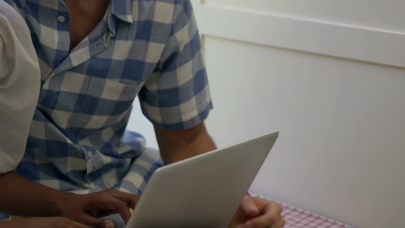 Young couple using laptop