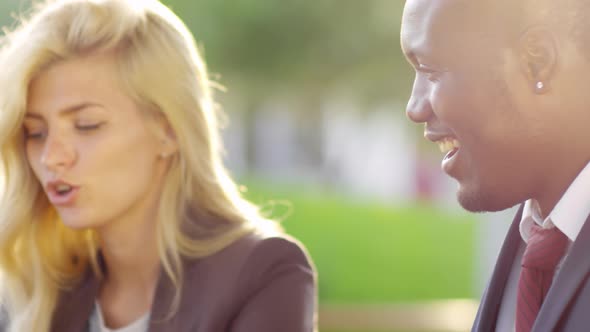 Multiethnic Colleagues Discussing Work Outdoors