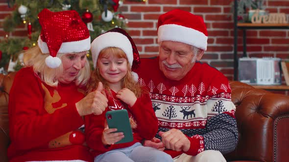 Senior Family Grandparents Granddaughter Purchase Online Christmas Gifts on Mobile Phone Shopping