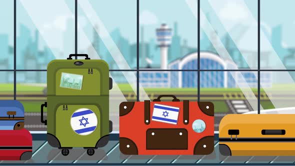 Suitcases with Israel Flag Stickers on Baggage Carousel in Airport