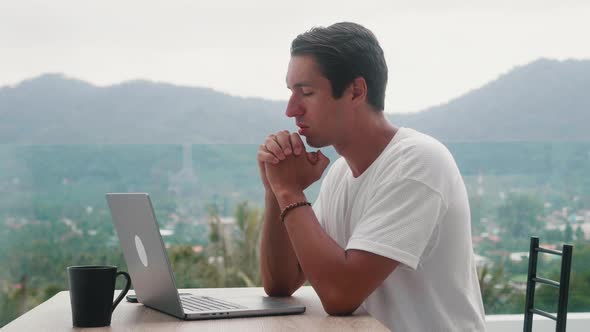 Sad Man Freelancer Asking for Help About Problem Praying to God While Working Distantly with Laptop