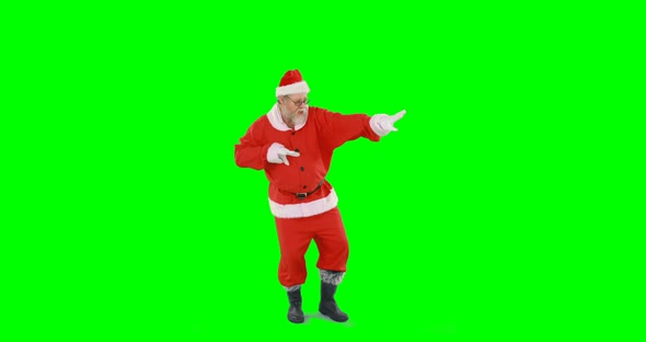 Santa claus dancing against green background