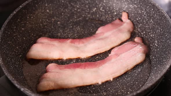 Frying pork bacon strips