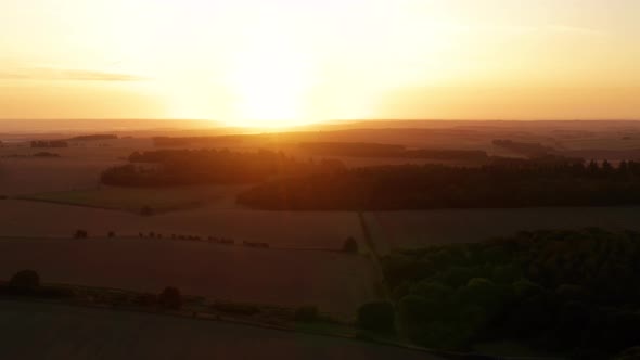English countryside from the air at sunrise in summer