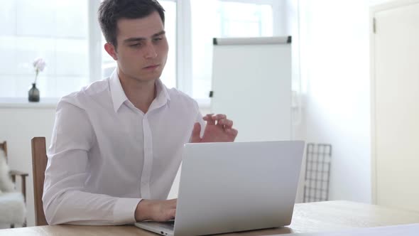 Tired Businessman with Neck Pain Working in Office