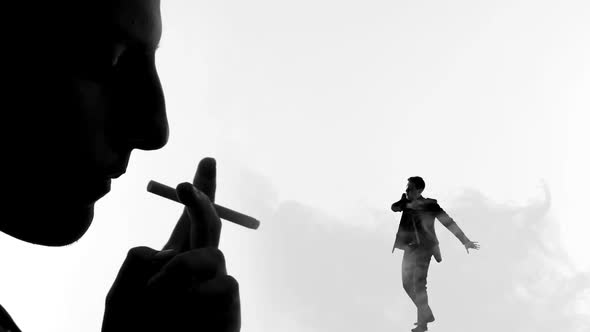Shadow of Male Smoking Cigarette, Exhaling Smoke on Tiny Man, Harmful Habit