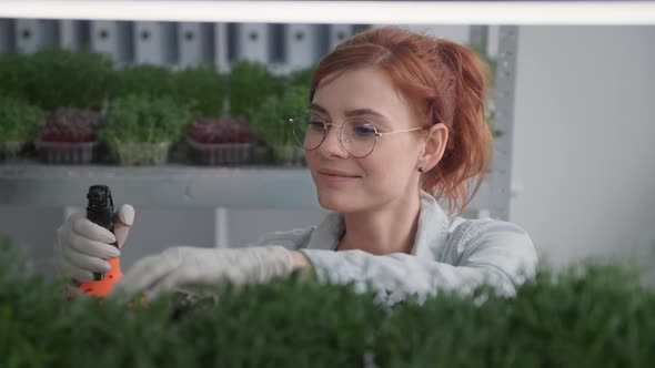 Healthy Food Portrait of Charming Young Woman Wearing Glasses Pours Clean Water From Spray Bottle