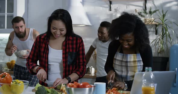 Group of People Preparing Food in the Kitchen