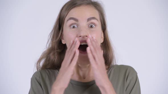 Face of Happy Young Beautiful Woman Looking Surprised