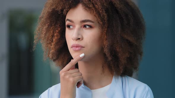 Female Portrait Outdoors African American Young Pensive Girl Woman with Curly Hair Deep in Thoughts