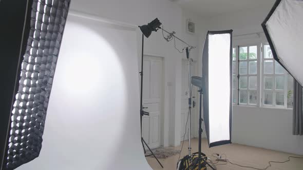 Empty Photo Studio With Lighting Equipment