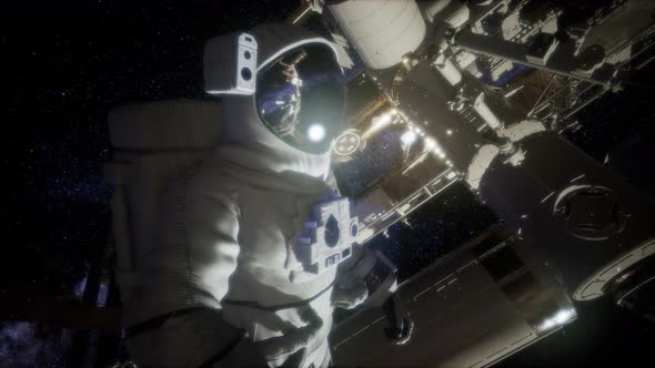 Astronaut Outside the International Space Station on a Spacewalk alt