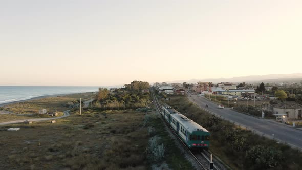 Aerial view of train passing near the cost