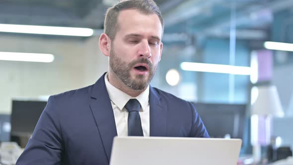 Portrait of Businessman Getting Upset While Working on Laptop