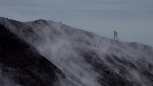 Silhouette of Man Hiking at Coldera of Avachinsky Stratovolcano Also Known As Avacha Volcano