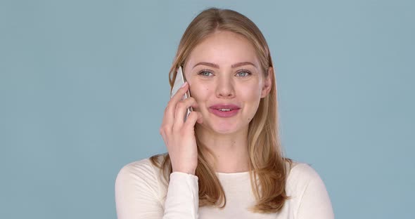 Adorable Happy Young Woman Talking on Her Mobile Phone