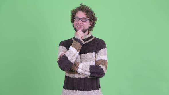 Happy Young Bearded Man Thinking Ready for Winter