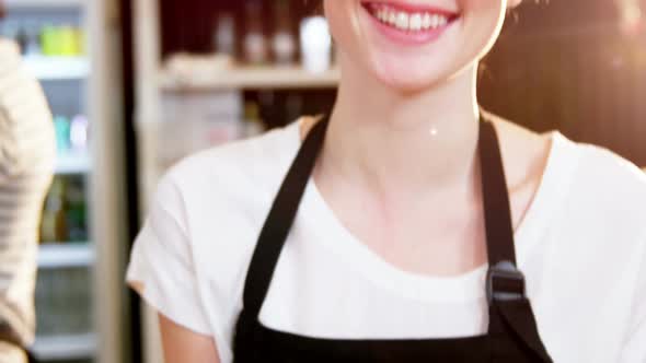 Waitress holding a tray of cake