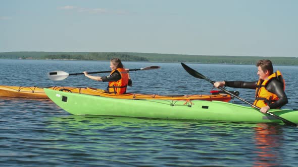 Kayaking Couple on Mountain Lake