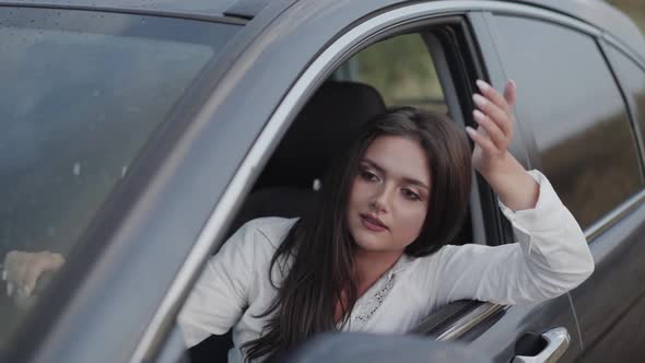 Woman in Car Hurries Up Looks Out on Traffic Jam and Talks to Herself