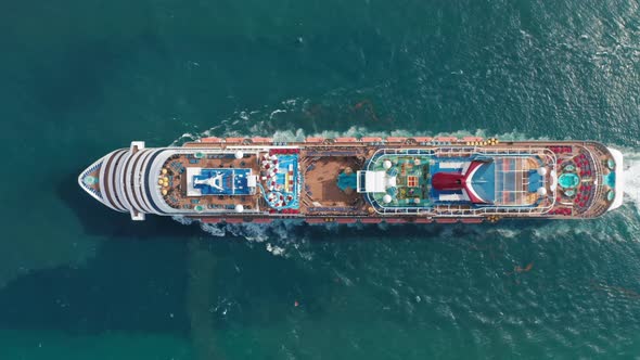  Aerial Top View of Luxury Large Cruise Ship with the Water Park Is Sailing alt