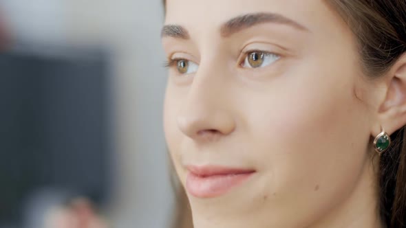 Makeup Artist Draws a Model Eyebrows with Pencil