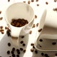 Coffee beans in white cups. Traditional morning drink - VideoHive Item for Sale