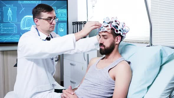 Doctor in a Neuroscience Centre Preparing Patien for Brain Analysis
