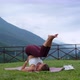 Woman is Performing Yoga Asana for Training Balance and Strength in Park - VideoHive Item for Sale