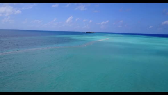 Aerial top down landscape of paradise coast beach vacation by blue water with white sand background 