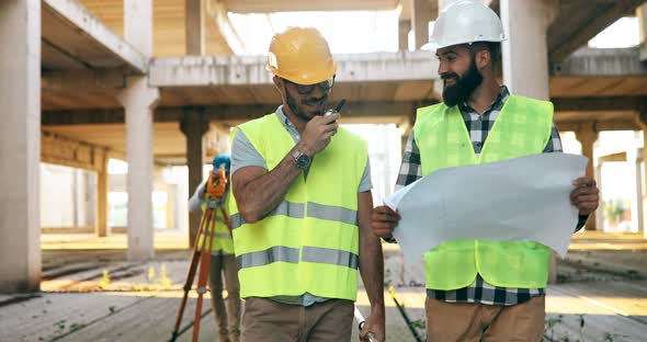 Portrait of Construction Engineers Working on Building Site