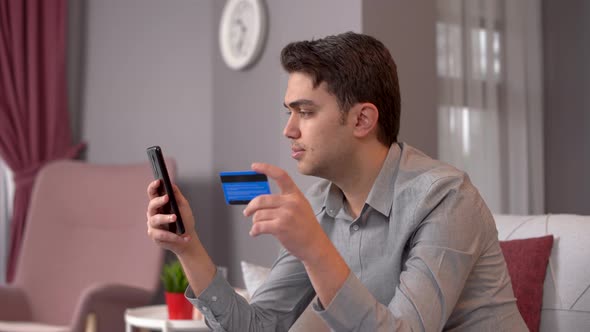 Shopping on the phone with a credit card.