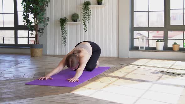 beautiful girl practicing yoga at home, doing various asanas