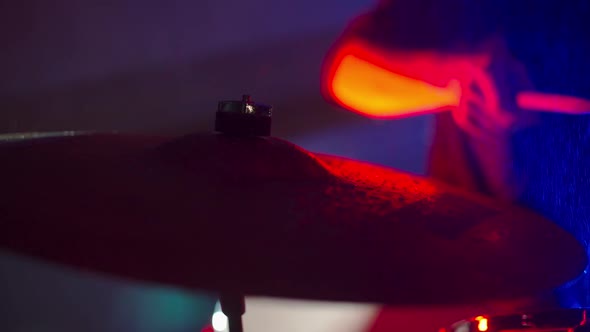 Drummer Playing Drums in the Club
