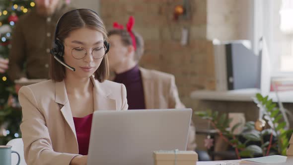 Portrait of Asian Businesswoman Working in Office on Christmas
