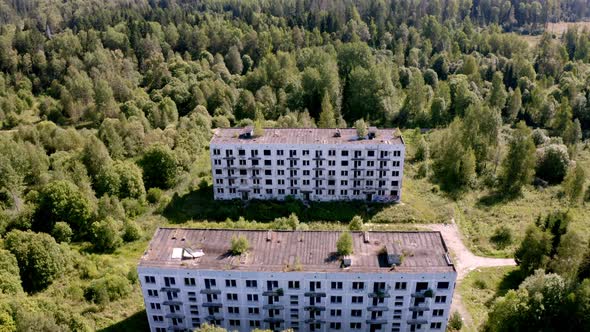 Aerial View of Abandoned and Destroyed Buildings From the Times of the USSR in a Green Picturesque